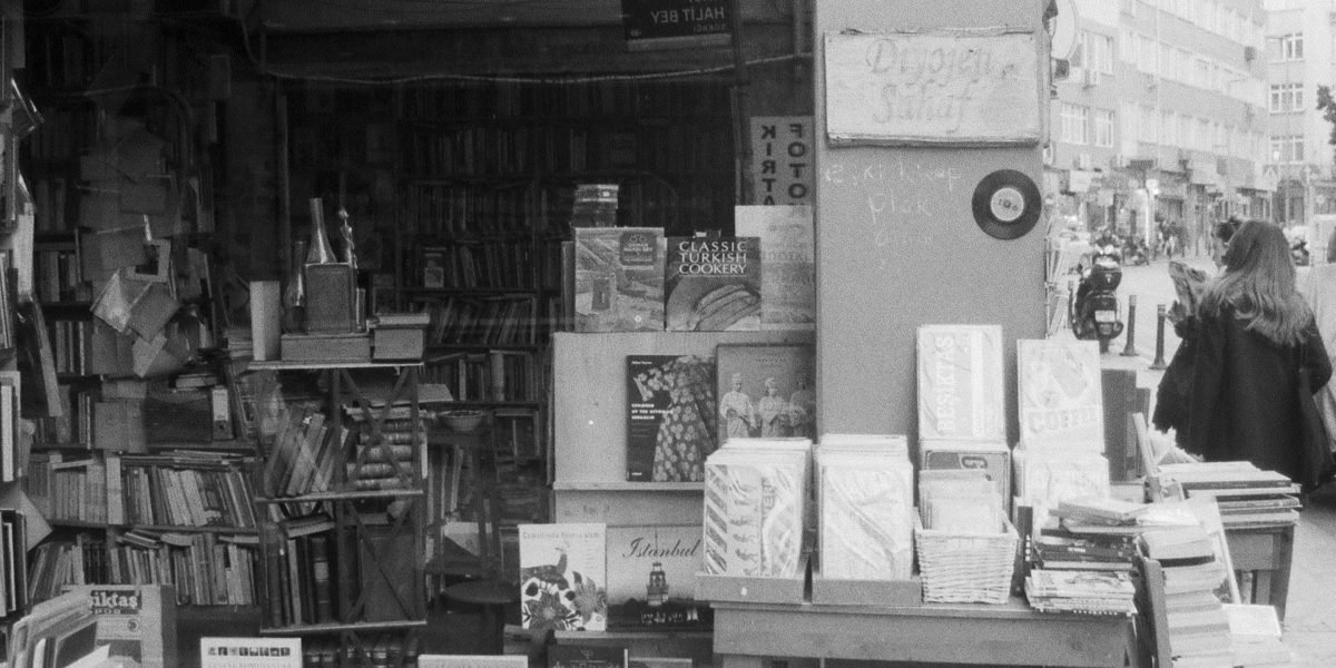 A bookseller offers personalized recommendations to a customer, a key advantage of independent bookstores.