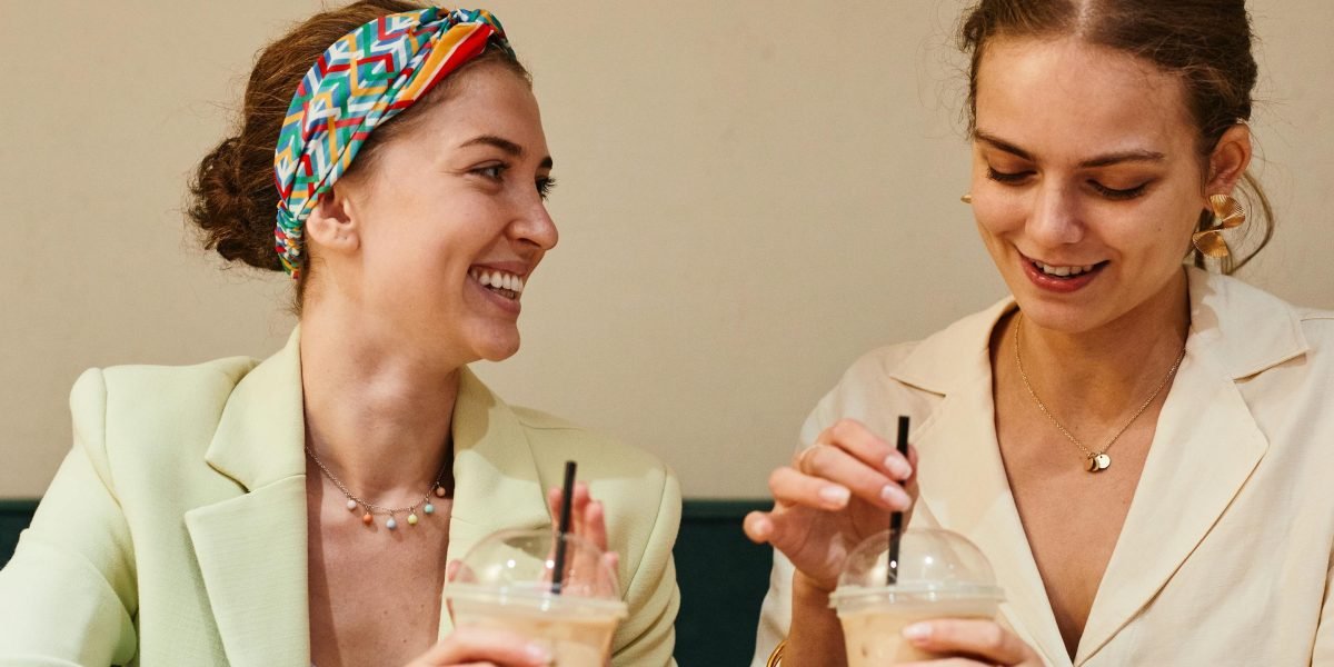 Friends sharing a laugh, symbolizing the joy a well-chosen funny book can bring to a social setting.