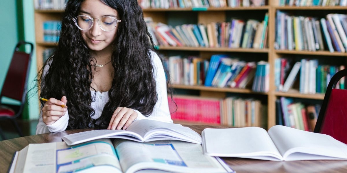 A person happily discovering a book that perfectly matches their reading preferences.