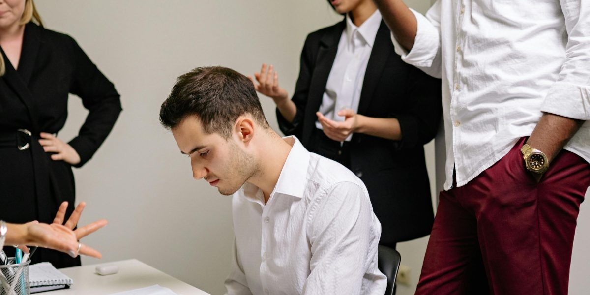 A group of people engaged in an animated discussion, expressing varied opinions and perspectives.