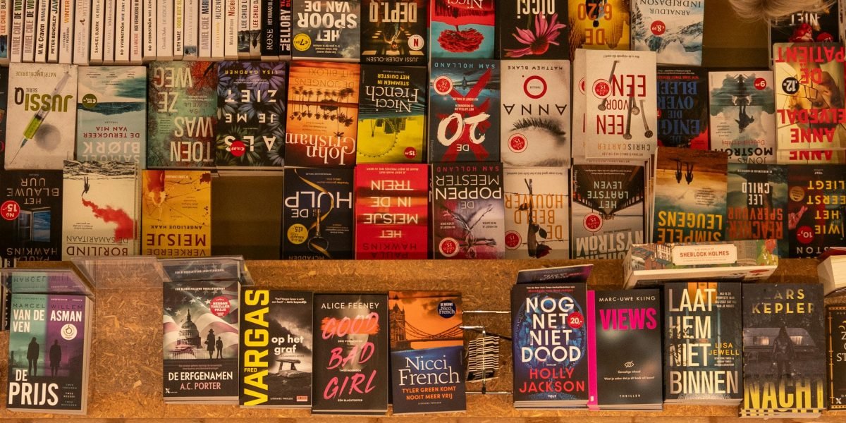 A customer receives personalized recommendations from a knowledgeable bookseller, finding the perfect book.